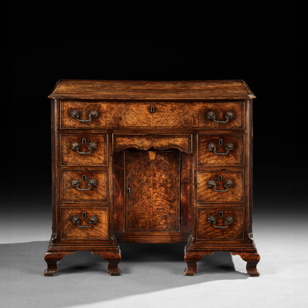 A George II Fiddleback Walnut Kneehole Desk
